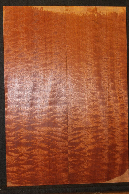 Quilted figured sapele guitar bookmatched drop top.