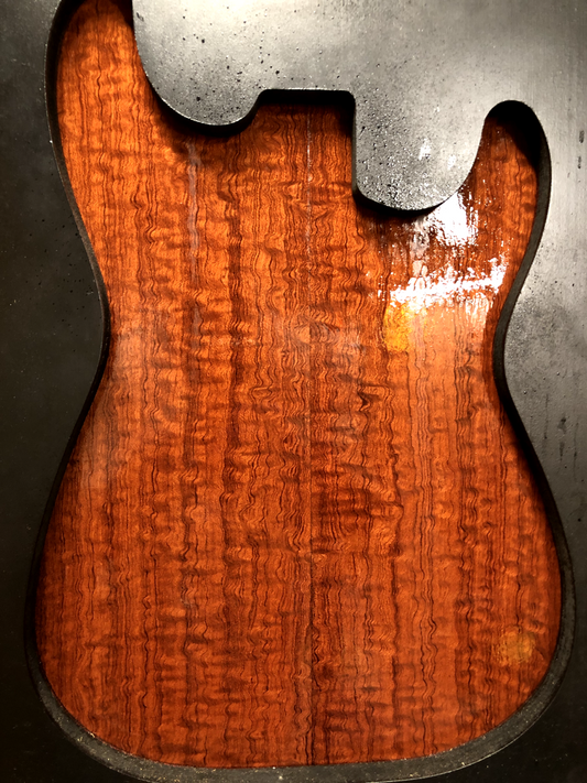 Figured quarter sawn bubinga guitar drop top.