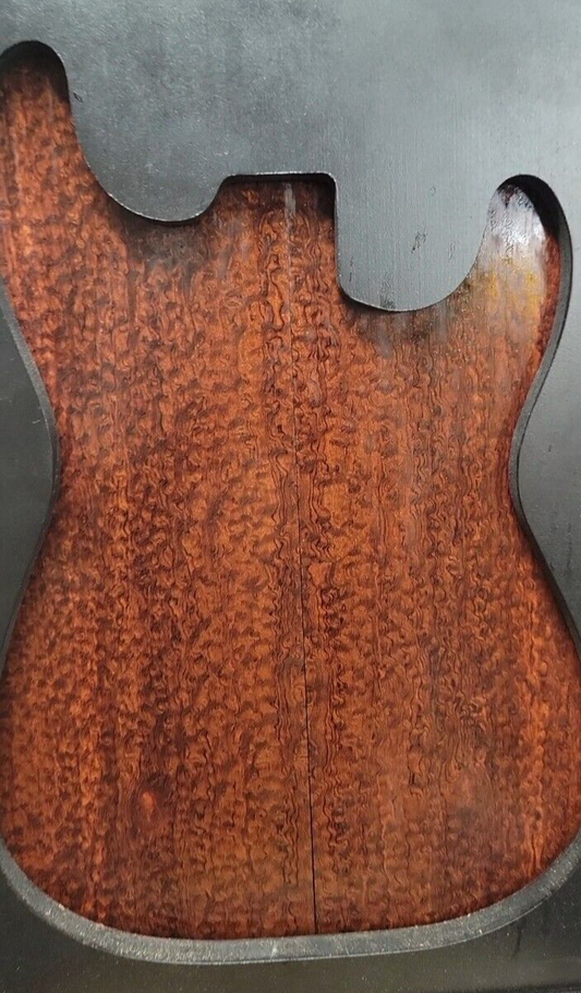 Pomelle figured bubinga electric guitar drop top.