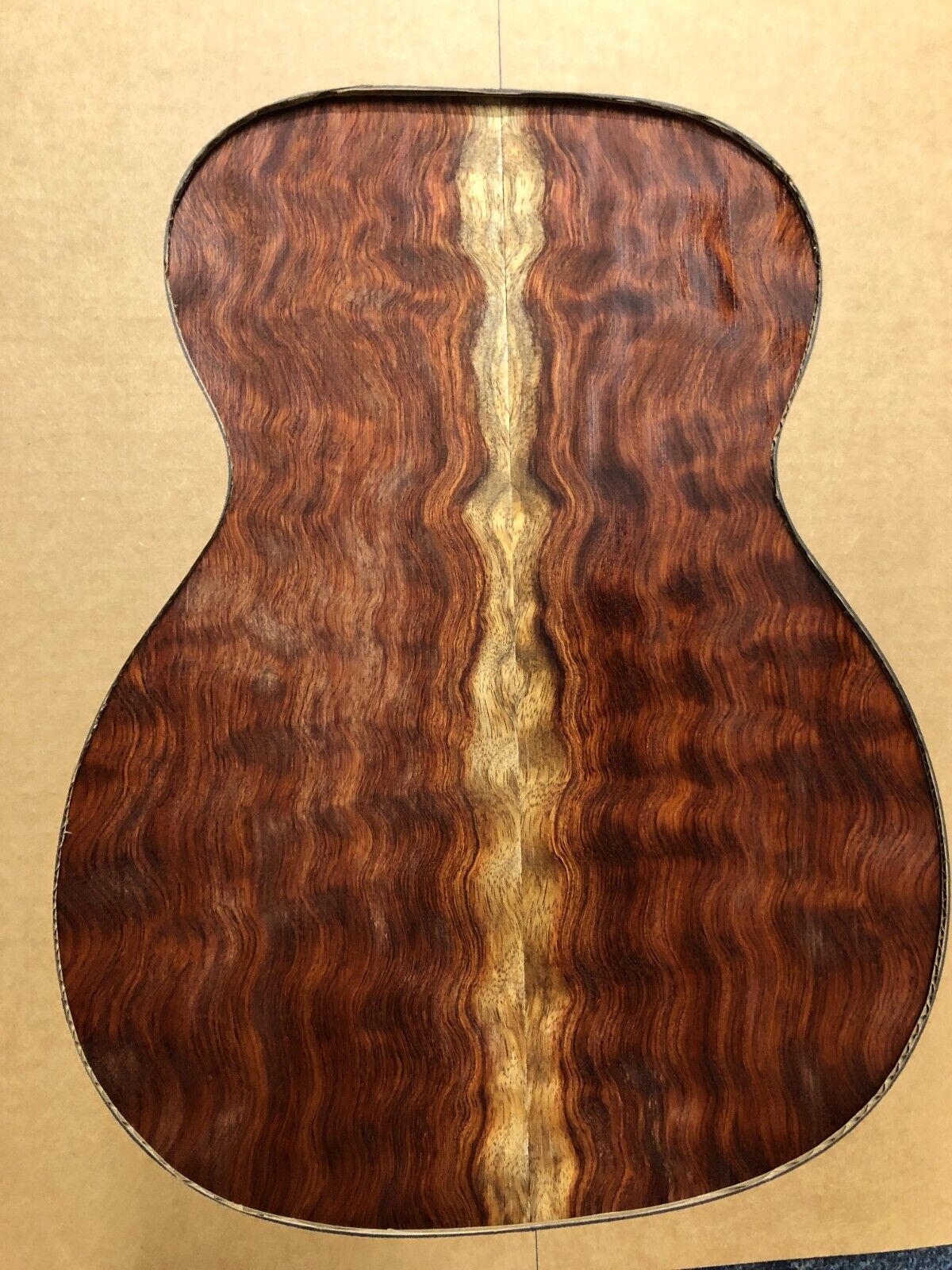 Waterfall figured bubinga  back and side set. Stunning grain, color and figure.