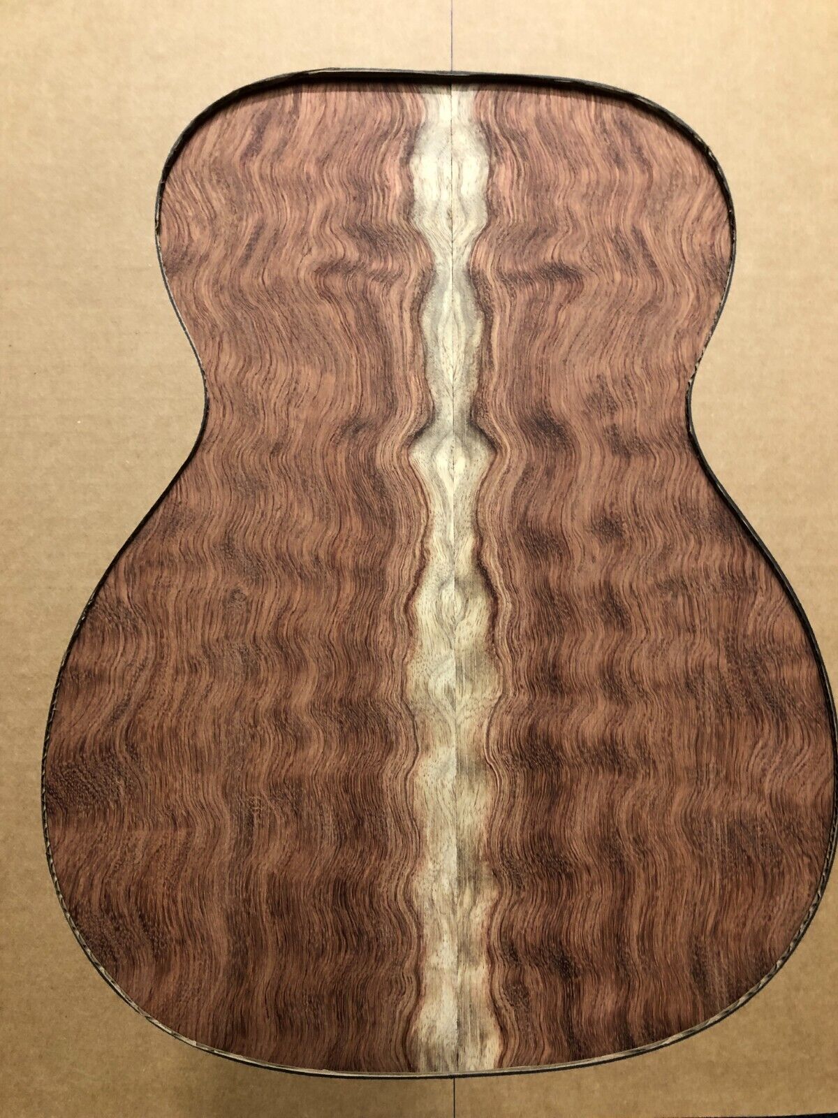 Waterfall figured bubinga  back and side set. Stunning grain, color and figure.